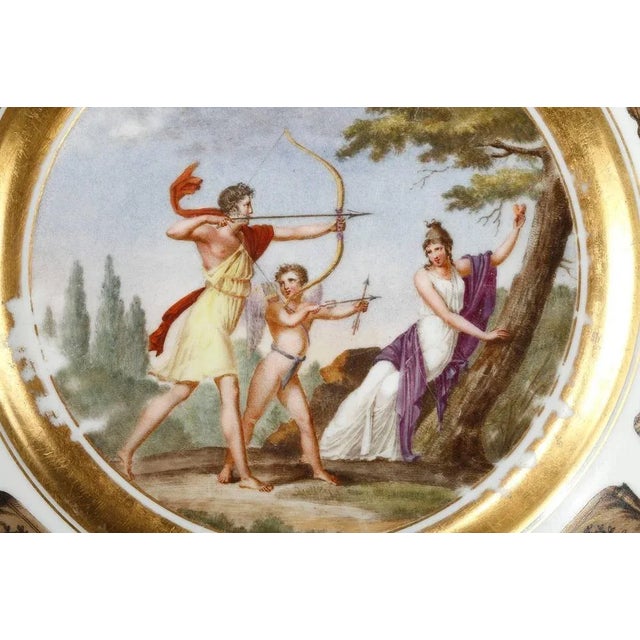 Earthenware plate from the creil factory, decorated with a mythological scene in a landscape. In this scene, a young man...
