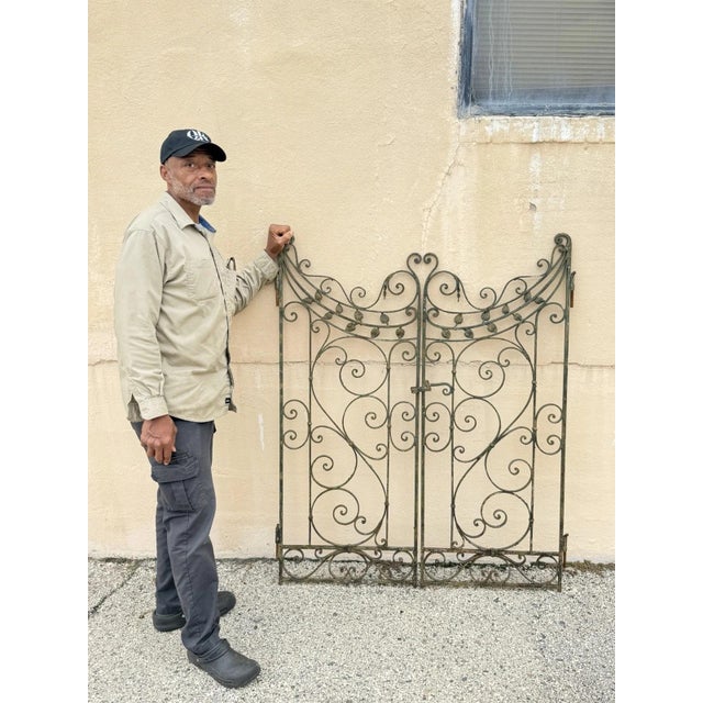 Antique Spanish Renaissance Scrolling Wrought Iron Garden Entry Gate Set. Set includes (1) right and (1) left gate with...