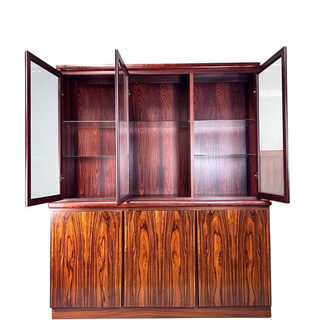 For sale is this absolutely stunning vintage rosewood danish cabinet made by Rasmus.