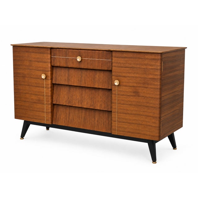 A striking fully restored Beautility “Beehive” sideboard, combining distinctive British mid-century design with generous...