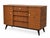 A striking fully restored Beautility “Beehive” sideboard, combining distinctive British mid-century design with generous...