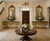 A striking and highly decorative pair of large-scale giltwood console tables crafted in the Italian Baroque Revival style...