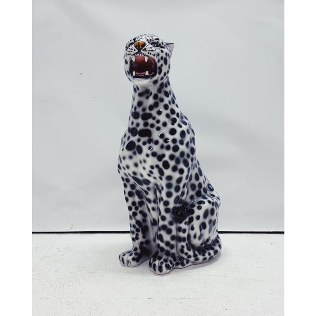 Unique handmade statue of a snow leopard. This Hollywood Regency statue, crafted from hand-painted ceramic and made in...