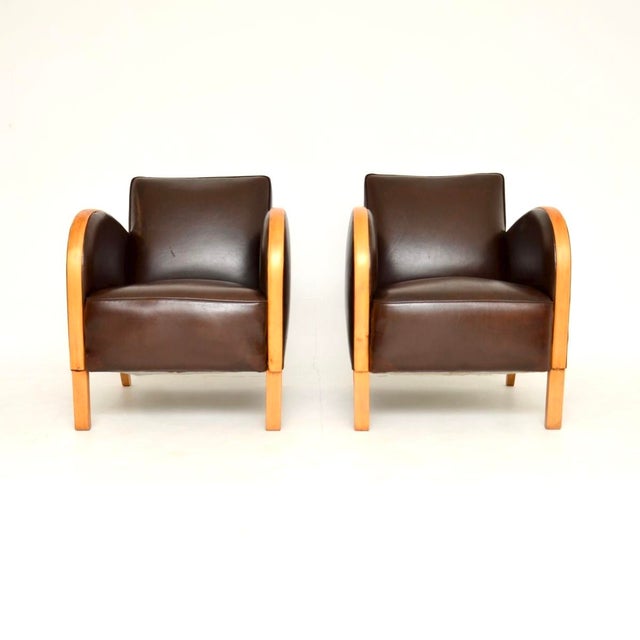 A stylish and very well made pair of Swedish Art Deco armchairs in satin birch and leather. They were recently imported...