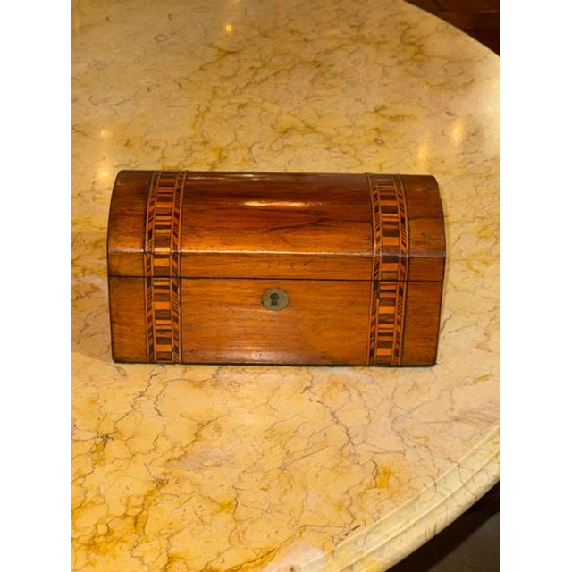 This product is a beautifully crafted 19th century German walnut inlaid box, adding a touch of elegance and history to any...