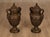 High Quality Pair Of Cast Bronze Urns Featuring Classical Form With Domed Lids And Finials. Bodies Are Decorated With...