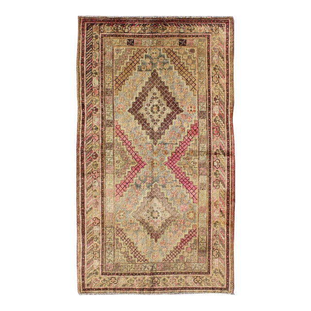 Early 20th Century Antique Khotan Rug With Paired Diamond Medallions in Wine Red For Sale