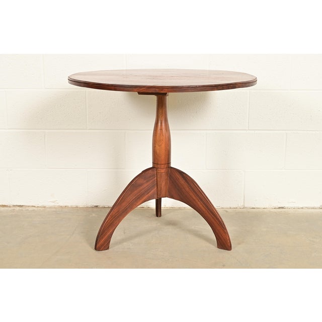 A gorgeous bench made Early American style sculpted solid walnut pedestal side table or tea table In the manner of...