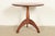 A gorgeous bench made Early American style sculpted solid walnut pedestal side table or tea table In the manner of...