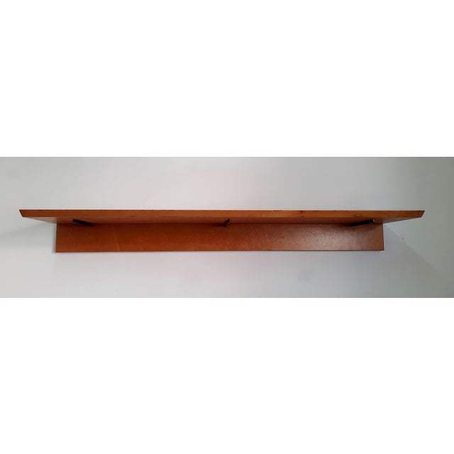 Wooden wall shelf by Milanese designer Giovanni Offredi and produced by the historic luxury furniture brand Saporiti...