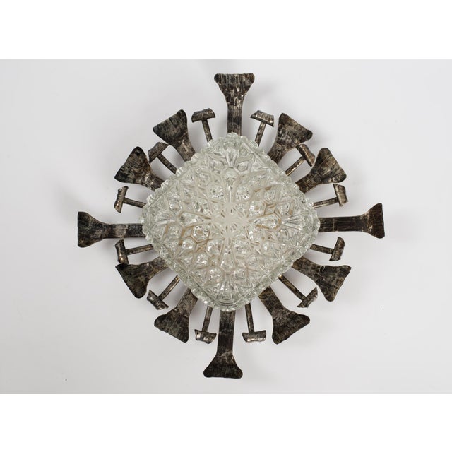 Command attention with this exceptional mid-century flush mount fixture, handcrafted in Spain during the 1950s. A...