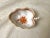 This pristine small handled leaf trinket dish, handcrafted by Herend Hungary in the classic Chinese Bouquet Rust (Apponyi...