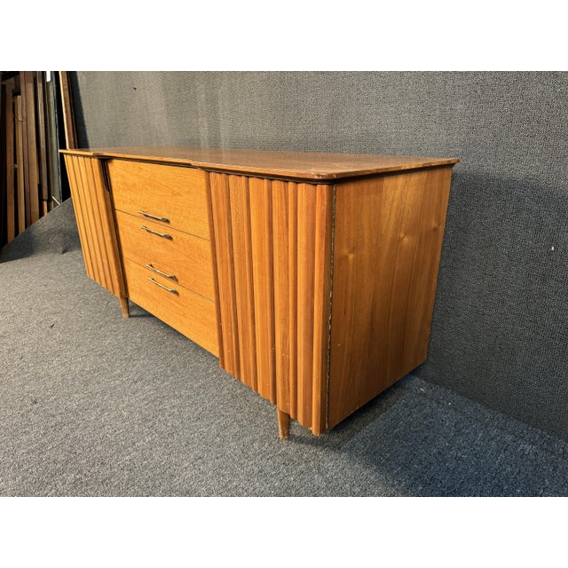Understated vintage sideboard featuring 4 drawers and shelving for all your dinning room storage needs. Dimensions...