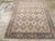 This mid-20th-century Persian Afshar rug presents a highly organized allover geometric composition across a warm ivory...