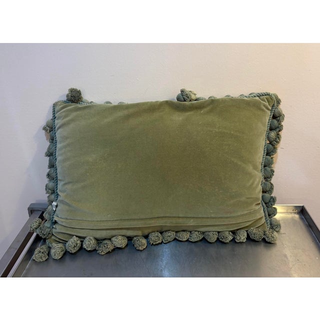 Elephant/palms needlepoint pillow with green pompom fringe and green velvet backing. Excellent condition. Measures 19" x...