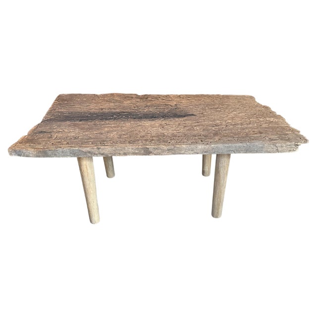 Beautiful Wabi Sabi hand carved coffee table. We added minimalist legs to this single wood piece originally used as an...