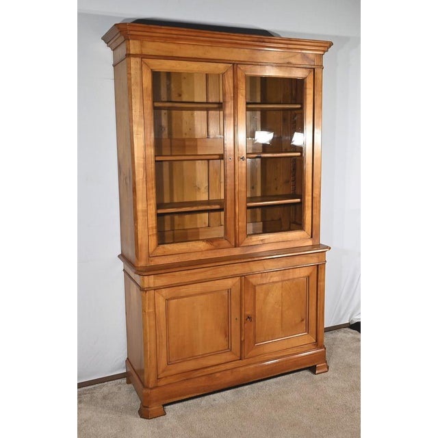 Regional furniture in solid blonde cherry trees, composed of a high element and a low element. The buffet part has tab...