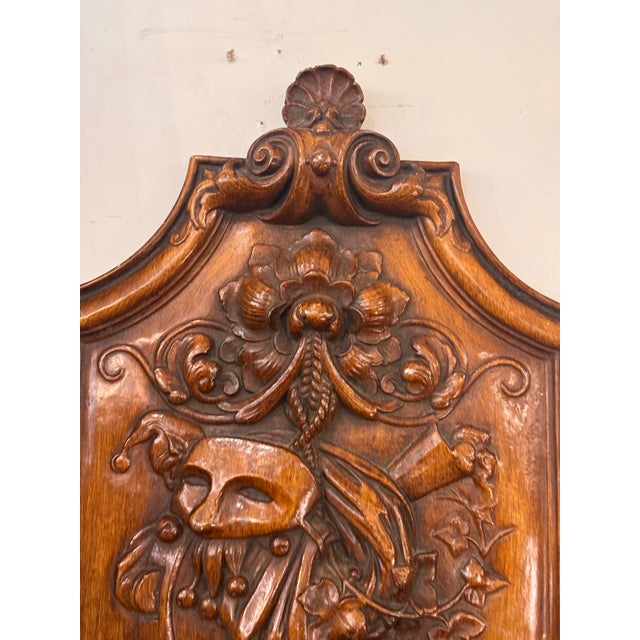 Design Plus Gallery presents an Antique Ceramic Masquerade Wall Shield. This decorative wall shield is formed in ceramic...