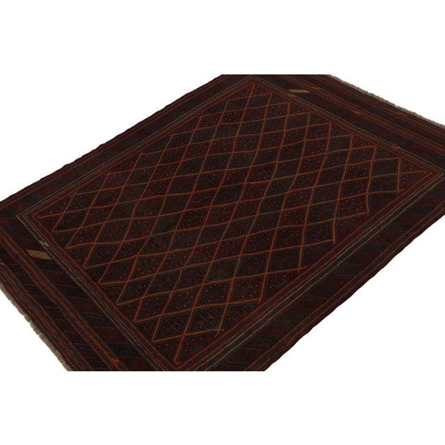 Hand-knotted in wool circa 1950-1960, this 7x9 vintage Afghani tribal rug is a new curation from Rug & Kilim. On the...