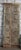 A stunning set of antique double doors showcasing intricate floral hand carvings and a richly aged rustic patina. Crafted...