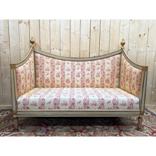 A louis xvi period salon suite comprising a sofa and a pair of bergère armchairs in gray-green lacquered wood (with...