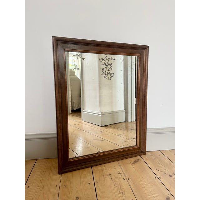 A lovely rustic wall mirror with original foxed glass dating from the early 20th century. Sourced from rural France. Solid...
