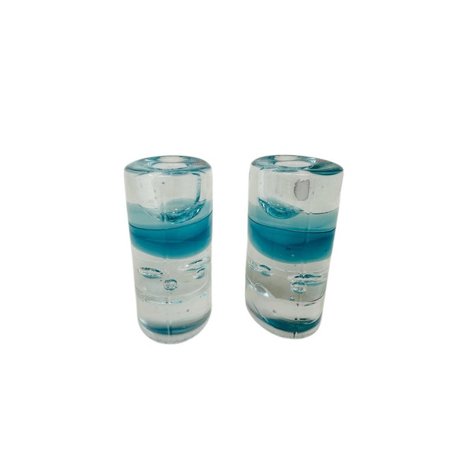 Bring a piece of Finnish design history into your home with this stunning pair of "Arktia" art glass candle holders....