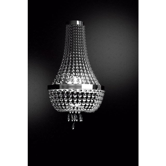 Allure 3 lights wall sconce in polished chrome and cut glass by aggiolight. Dimensions: w 38 x d 21 x h 69 cm. Materials:...