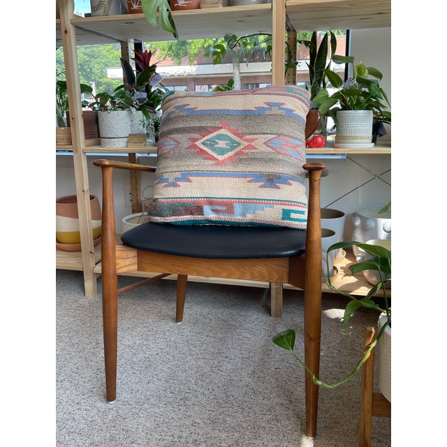 This vintage possibly wool pillow features a striking Southwestern-style kilim textile, handwoven with a bold geometric...