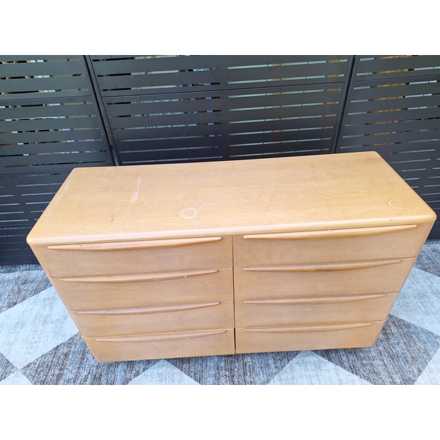 A classic mid-century modern lowboy dresser by Heywood-Wakefield, designed with eight generously scaled drawers and a...