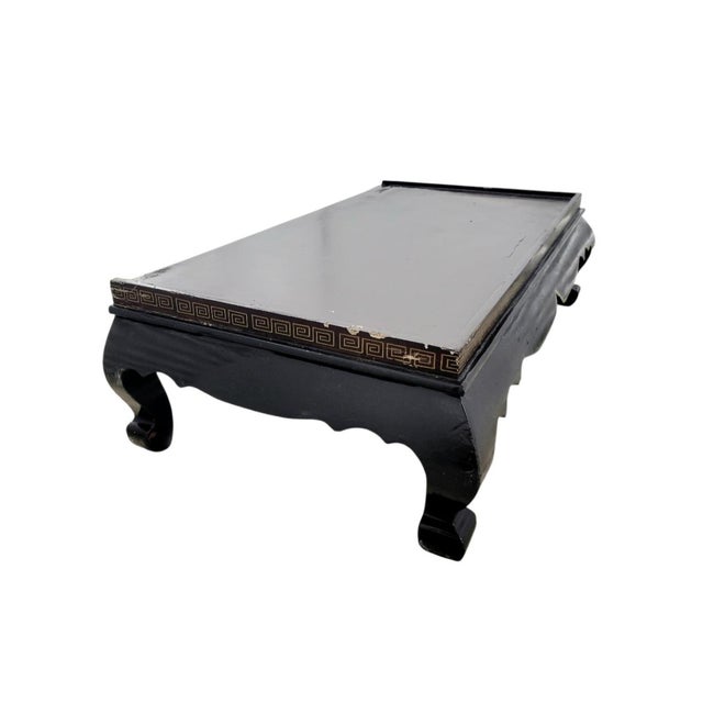 Make a dramatic statement with this striking Chinoiserie Asian black lacquer cabinet, featuring high-relief inlaid stone...