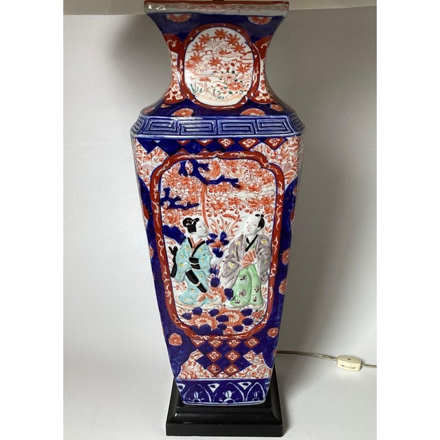 A large and vibrantly colored Imari vase dating from 1880 then electrified in the 1920"s. The classic iron red and cobalt...