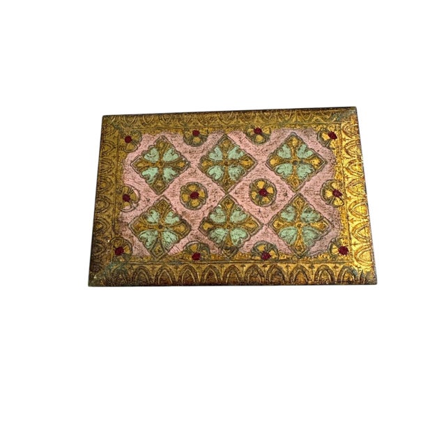 A charming Florentine box in soft pink with gilt decoration, crafted in Italy during the mid-20th century. The hand-...