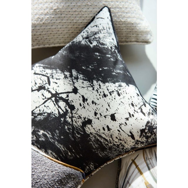 Alive with free-flowing movement and created outdoors by an expressive hand abstract markings twist and turn on a plain...