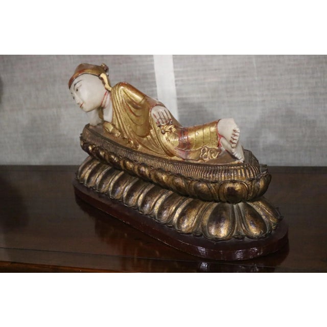 Alabaster Reclining Buddha with Wooden Base. Circa Mid 19th Century.
