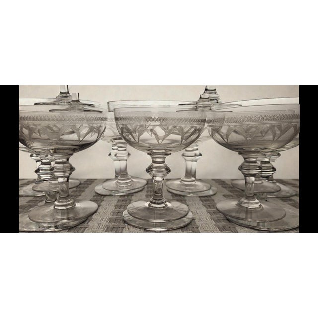 Set of 9 engraved crystal champagne coupes / Early 20th century, 1920s Height 11 cm Diameter 9.8 cm All are in good...