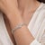 Elegant 18K white gold diamond bracelet featuring a refined floral and open-link design, set with approximately 2.78 Carat...