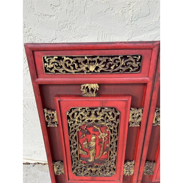 19th century, Chinese wall hanging carved from indigenous hardwood with the original red lacquer with gilt highlights.