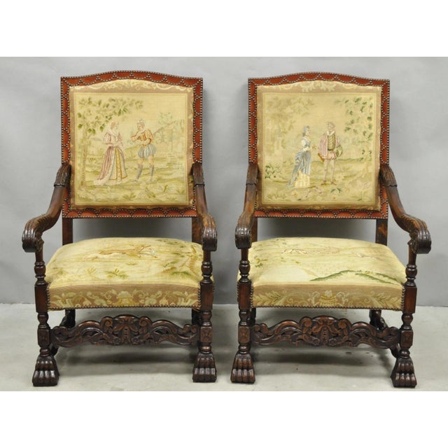 Stunning Antique French Louis XIV Style Figural Needlepoint Tapestry Carved Walnut Armchairs - a Pair. Chairs feature...