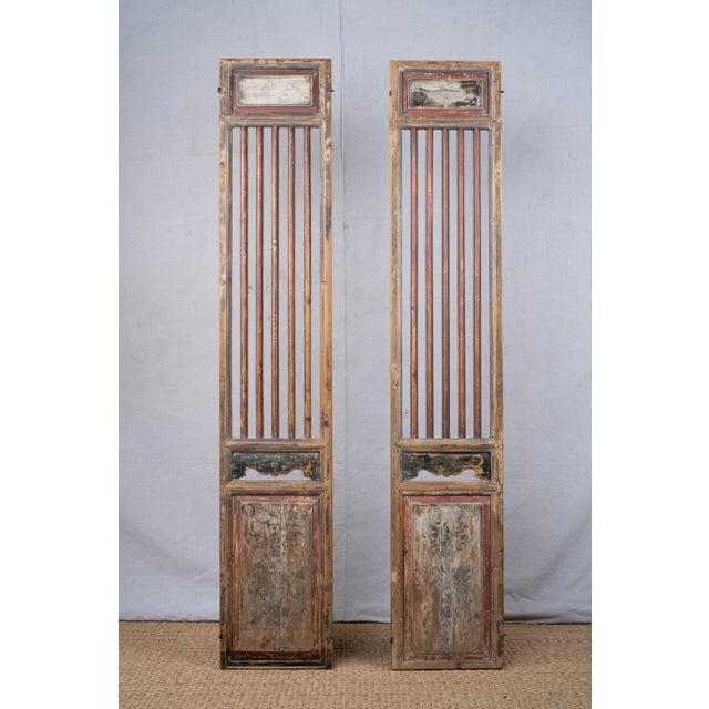 Pair of hand painted door/window panels, late 20th century, Japanese. Top sections are solid with painted fish motifs that...