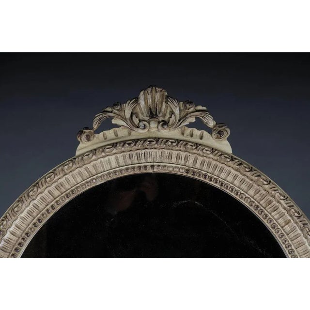 Solid beechwood, carved and painted. Semicircular high-rectangular body on conical, fluted legs. Cambered frame with...