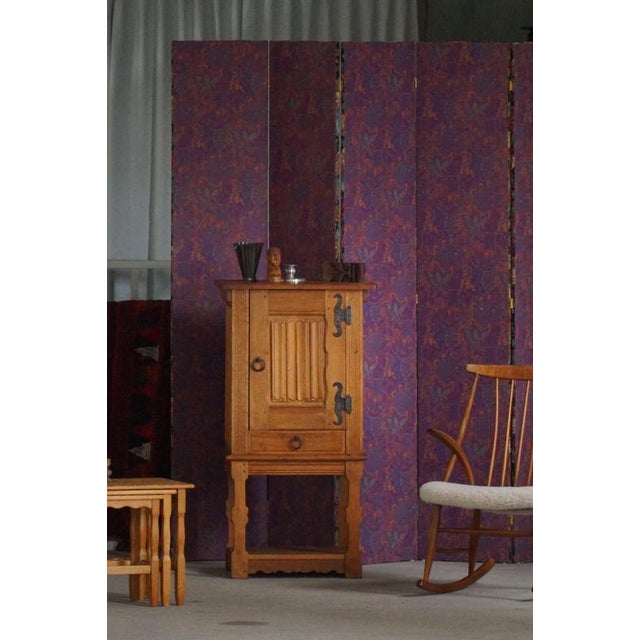 Charming Danish cabinet crafted in solid oak and raised on a matching stand. The design combines practical storage with...
