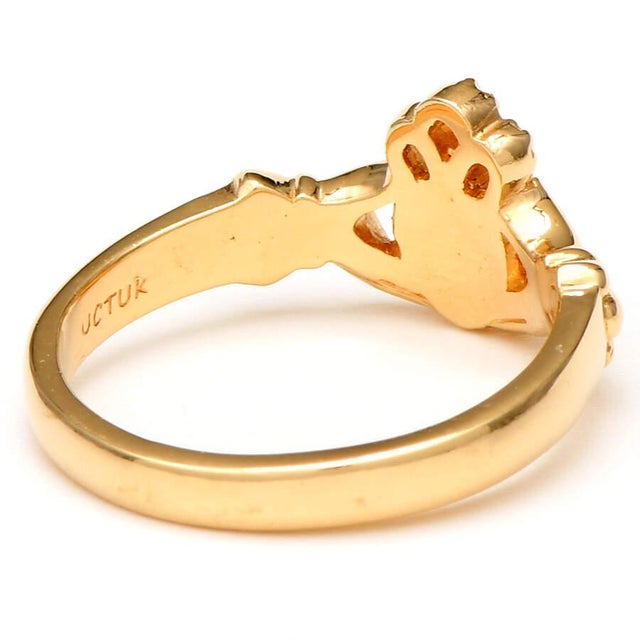 Satiny 14K yellow gold enhances the beauty and meaning of this artistically created Claddagh ring. The ring's Irish design...