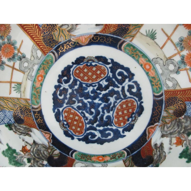 Antique Japanese Imari charger plate. Intricate hand painted flower and landscape medallion design. Measures 18 3/4" x 2...