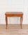 An elegant French game table reflecting the refined craftsmanship of the Louis XV period, dating to the eighteenth...