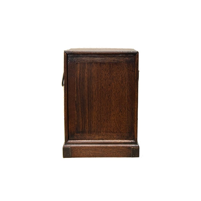 This elegant oriental-style chest is a masterclass in functional vintage design, crafted from deep, rich brown wood with a...