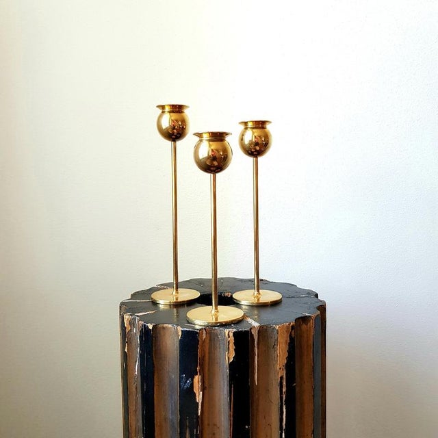 A set of three “Tulip” candlesticks by Pierre Forsell for Skultuna Bruk, Sweden. The set was manufactured during Forsell’s...