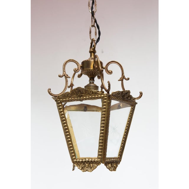 Each lantern has five glass panels; four of them are engraved with a star, and the fifth has no decoration. Height: 26 cm...