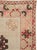 This Mid-20th century Turkish Anatolian square room-size carpet presents a balanced geometric composition centered on a...