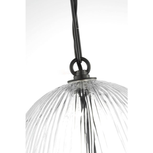 Serafina 11-inch Pendant by Hable brings a refined botanical presence to overhead lighting. Inspired by the silhouette of...
